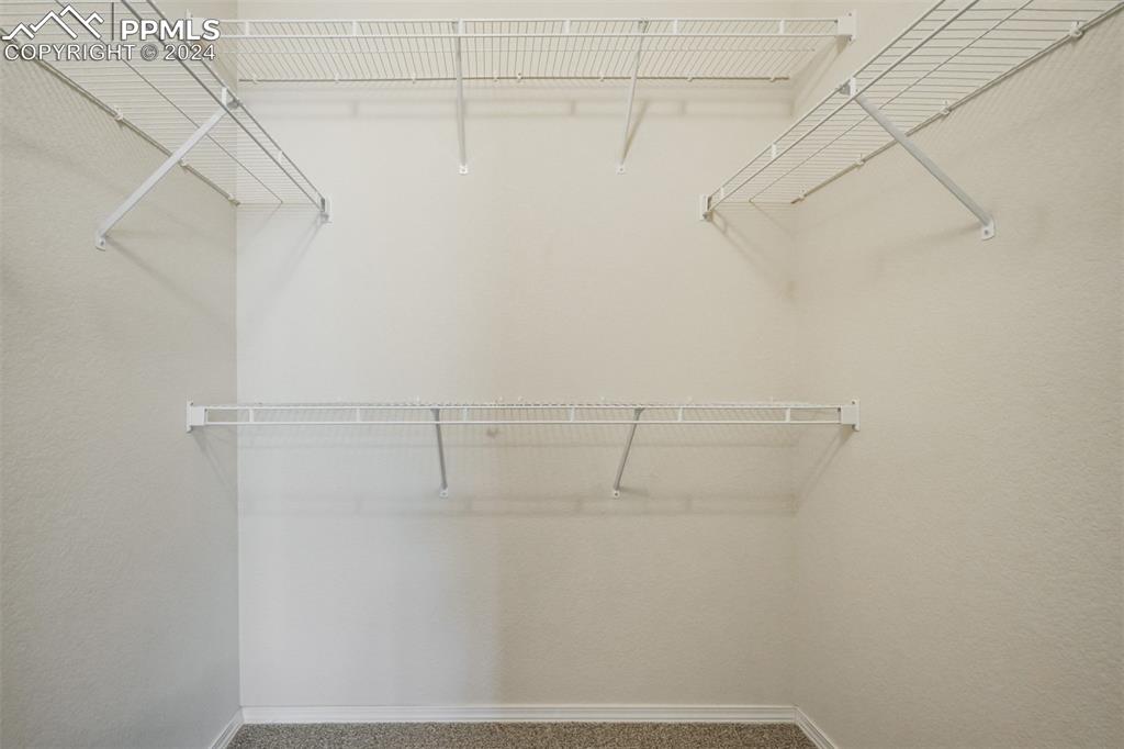 5353 Palomino Ranch Point, Unit 202 Colorado Springs, CO 80922 - Photo 25 of 34 a view of a room with racks on the wall