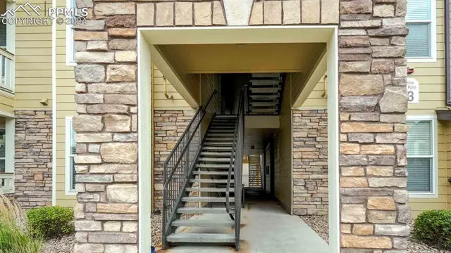 a front view of a house with stairs