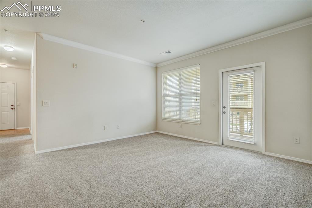5353 Palomino Ranch Point, Unit 202 Colorado Springs, CO 80922 - Photo 9 of 34 an empty room with windows