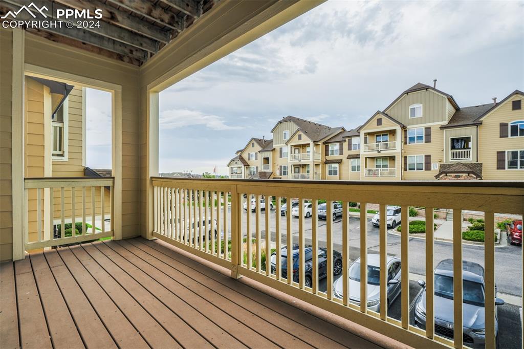 5353 Palomino Ranch Point, Unit 202 Colorado Springs, CO 80922 - Photo 10 of 34 a view of a large buildings from a balcony