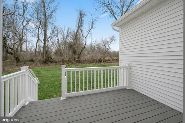 a view of a deck with trees
