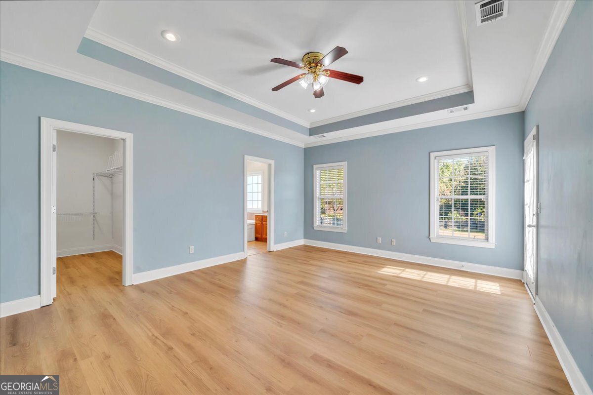100 Fox Den Court Dublin, GA 31021 - Photo 12 of 26 a view of an empty room with window and wooden floor