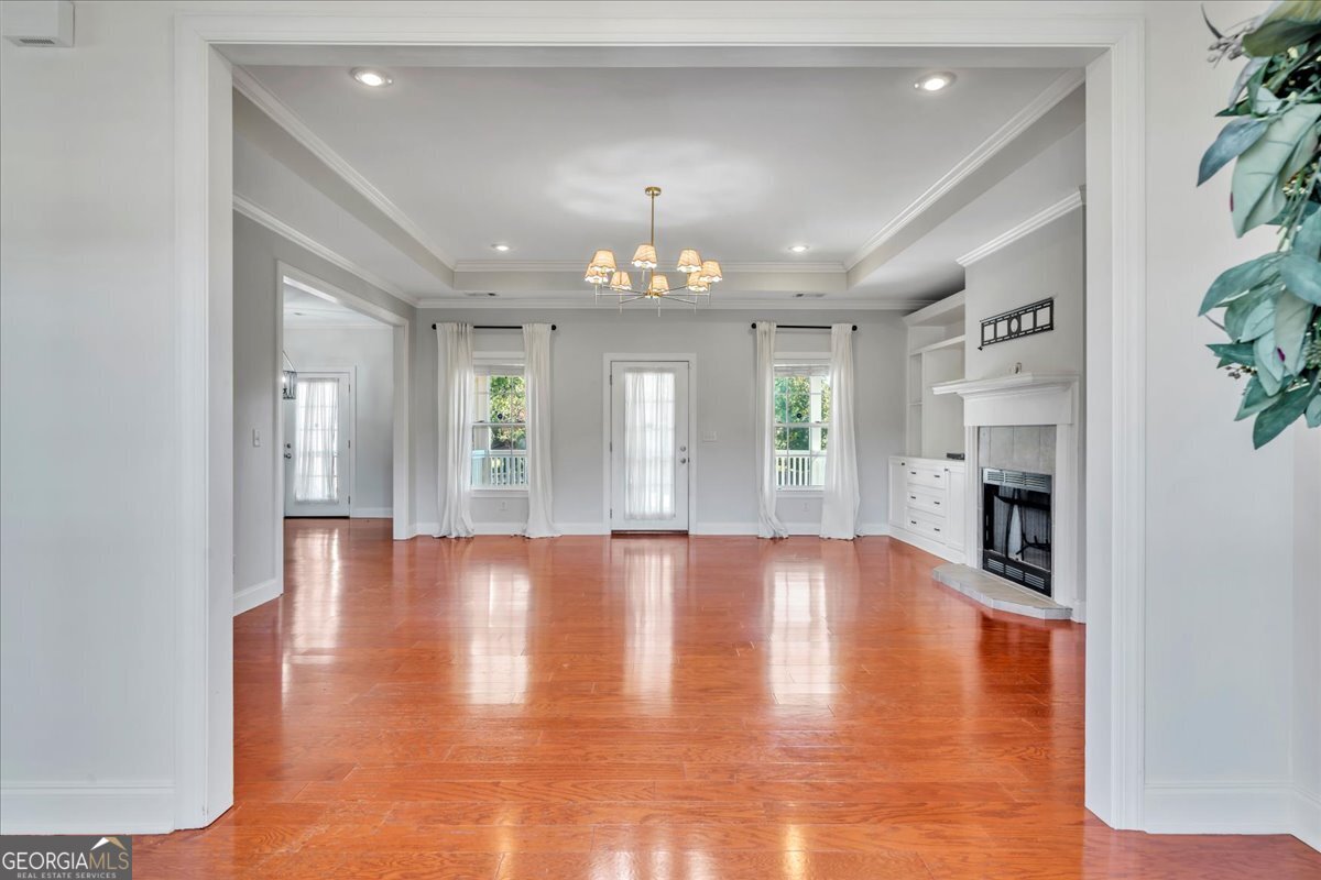 100 Fox Den Court Dublin, GA 31021 - Photo 2 of 26 a view of an empty room with window and fireplace