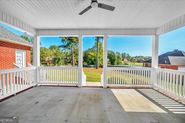 a view of a porch with wooden floor