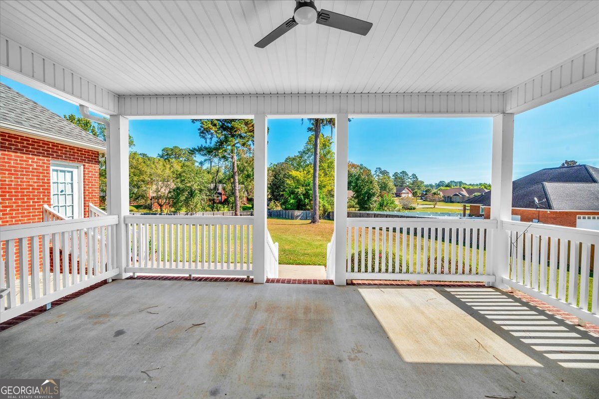 100 Fox Den Court Dublin, GA 31021 - Photo 21 of 26 a view of a porch with wooden floor