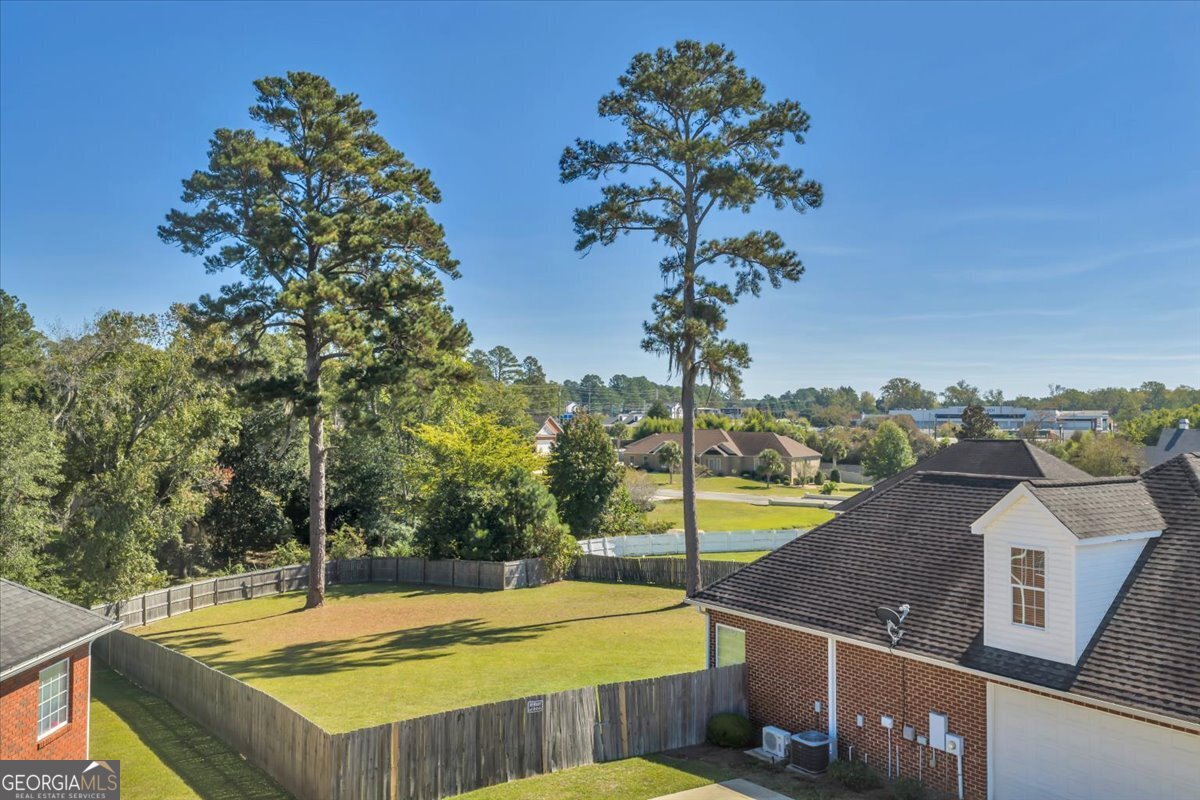 100 Fox Den Court Dublin, GA 31021 - Photo 24 of 26 a view of a balcony with two chairs and a table