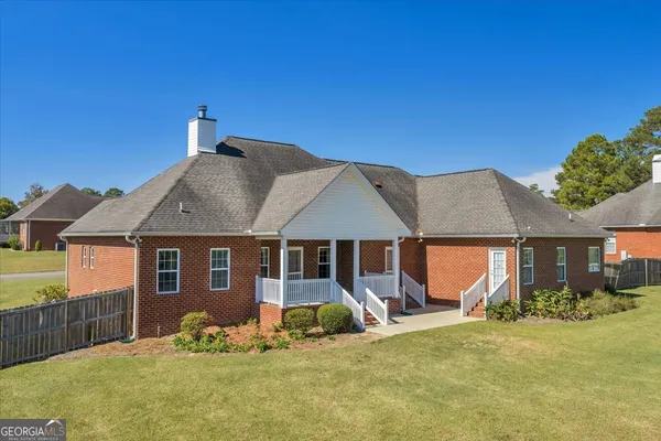 a front view of a house with a yard