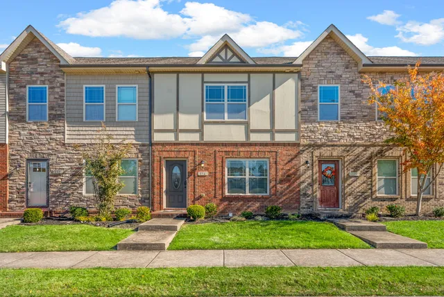 front view of a house with a yard