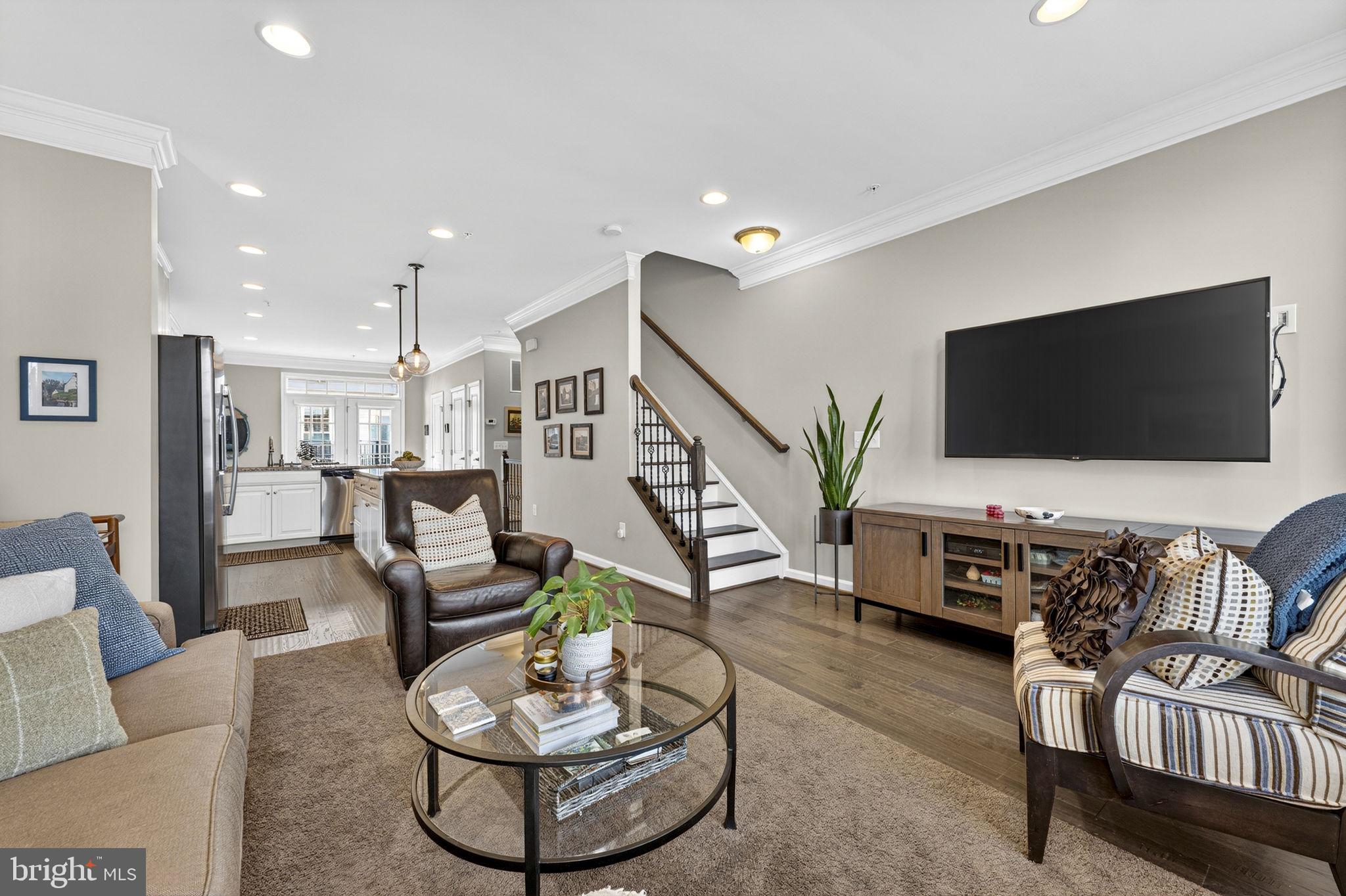 459 Haupt Square Southeast Leesburg, VA 20175 - Photo 11 of 80 a living room with furniture and a flat screen tv