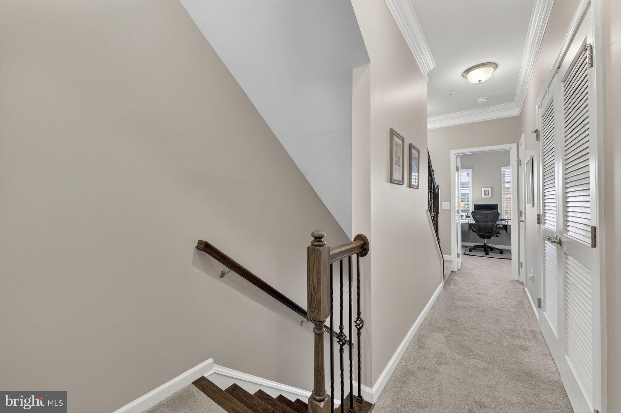 459 Haupt Square Southeast Leesburg, VA 20175 - Photo 27 of 80 a view of a hallway with wooden floor and staircase