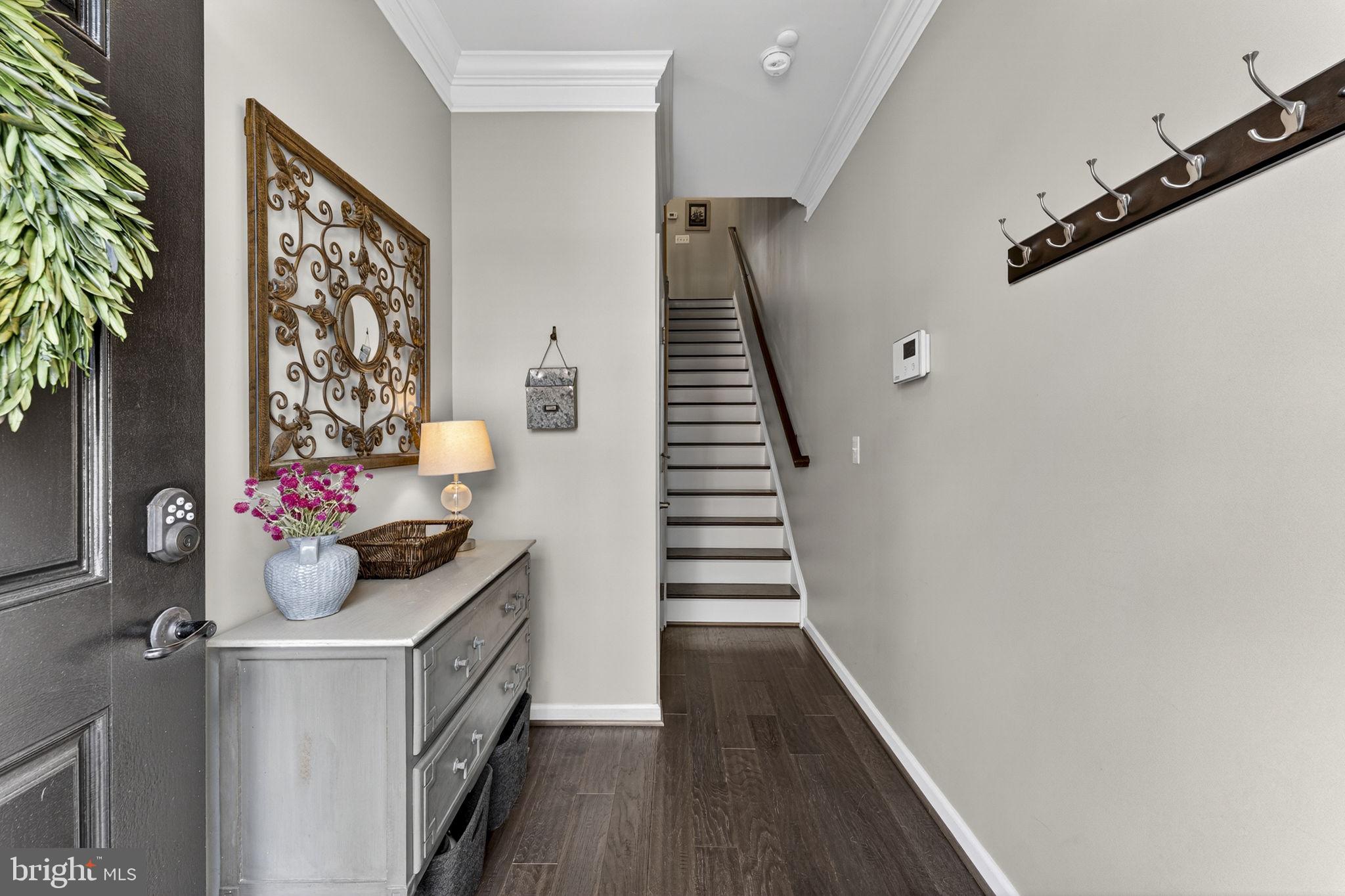 459 Haupt Square Southeast Leesburg, VA 20175 - Photo 3 of 80 a view of entryway and hall with wooden floor