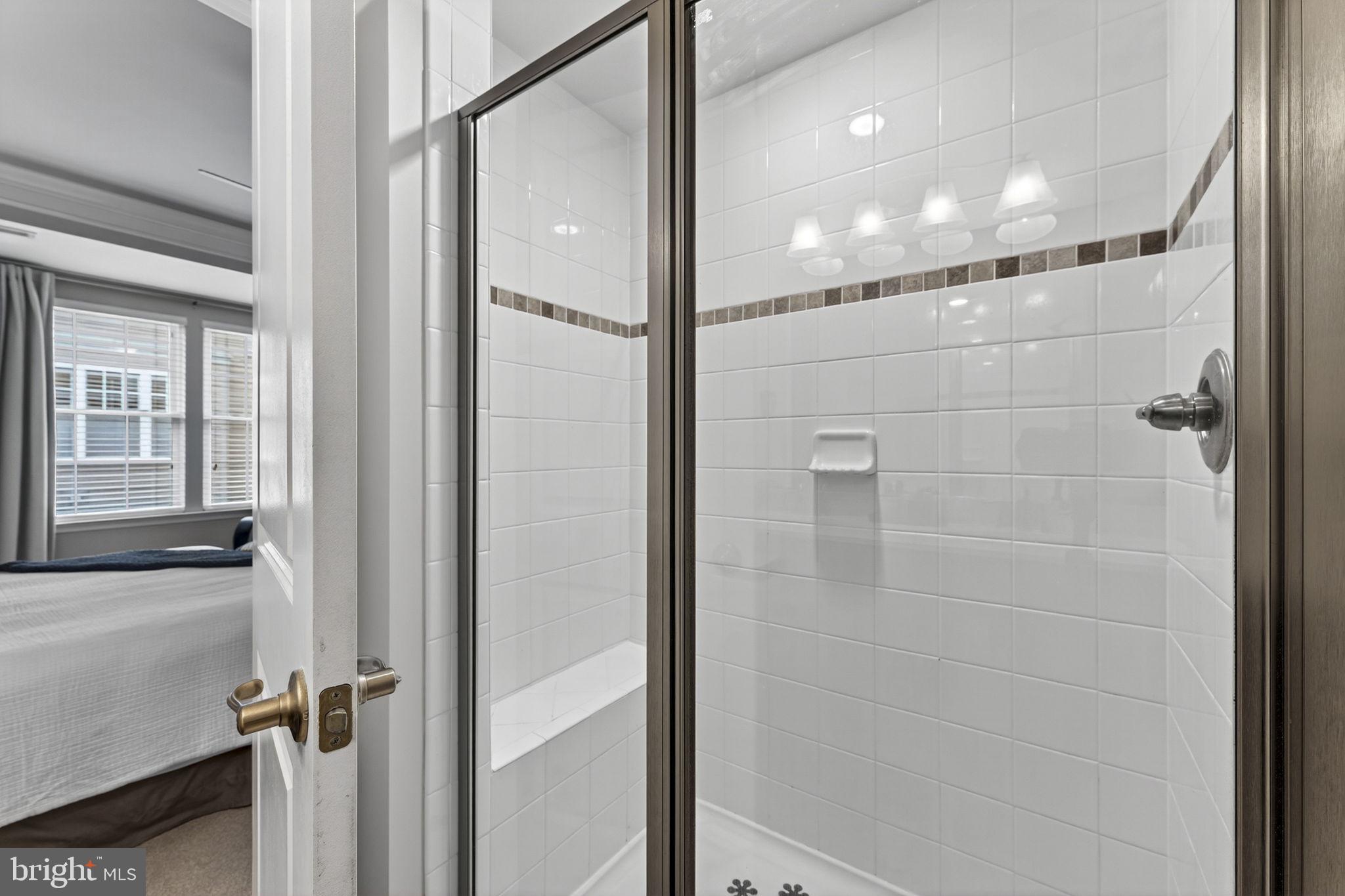 459 Haupt Square Southeast Leesburg, VA 20175 - Photo 39 of 80 a bathroom with a glass shower door