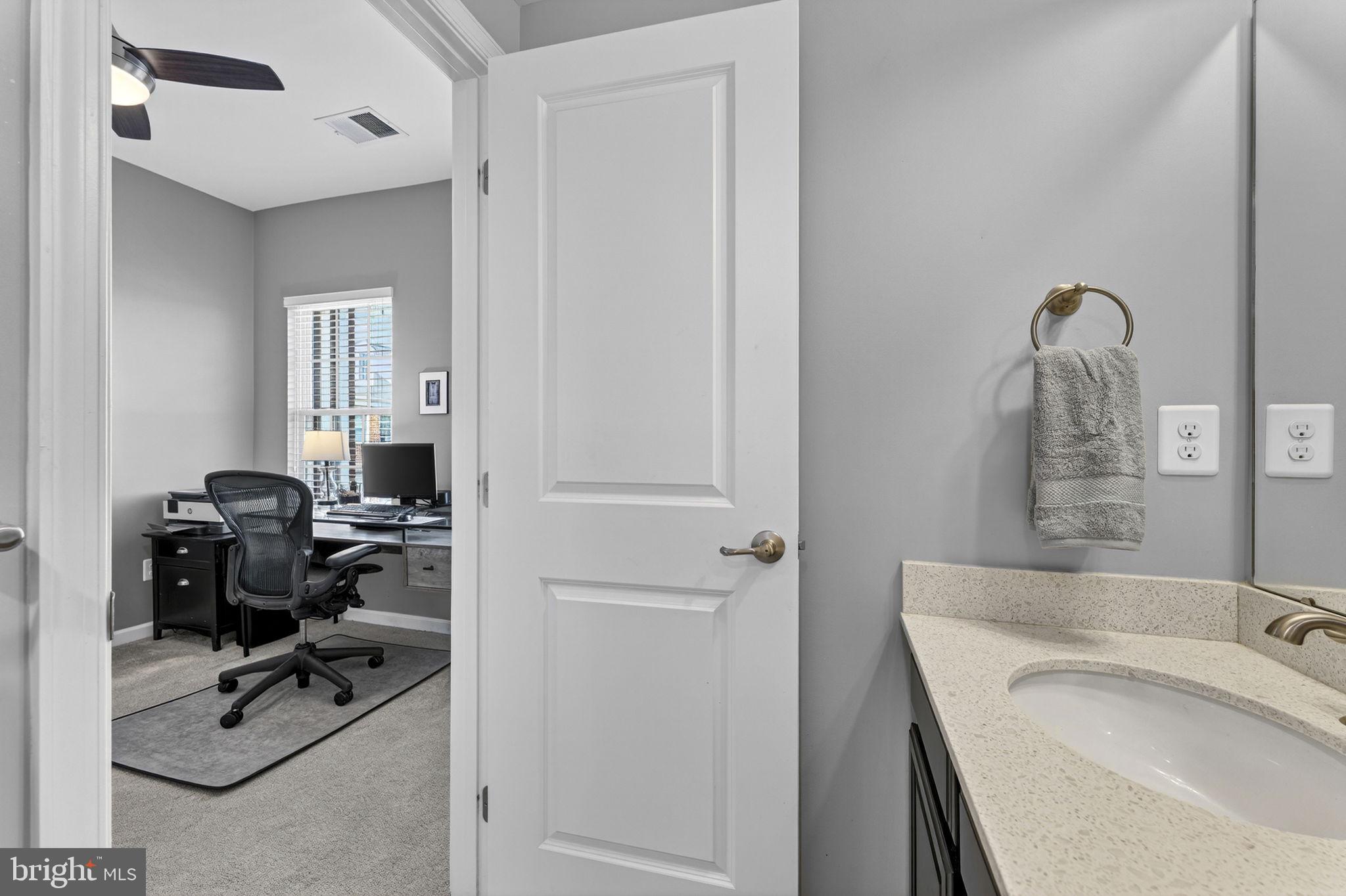 459 Haupt Square Southeast Leesburg, VA 20175 - Photo 46 of 80 a bathroom with a sink a toilet and a tub