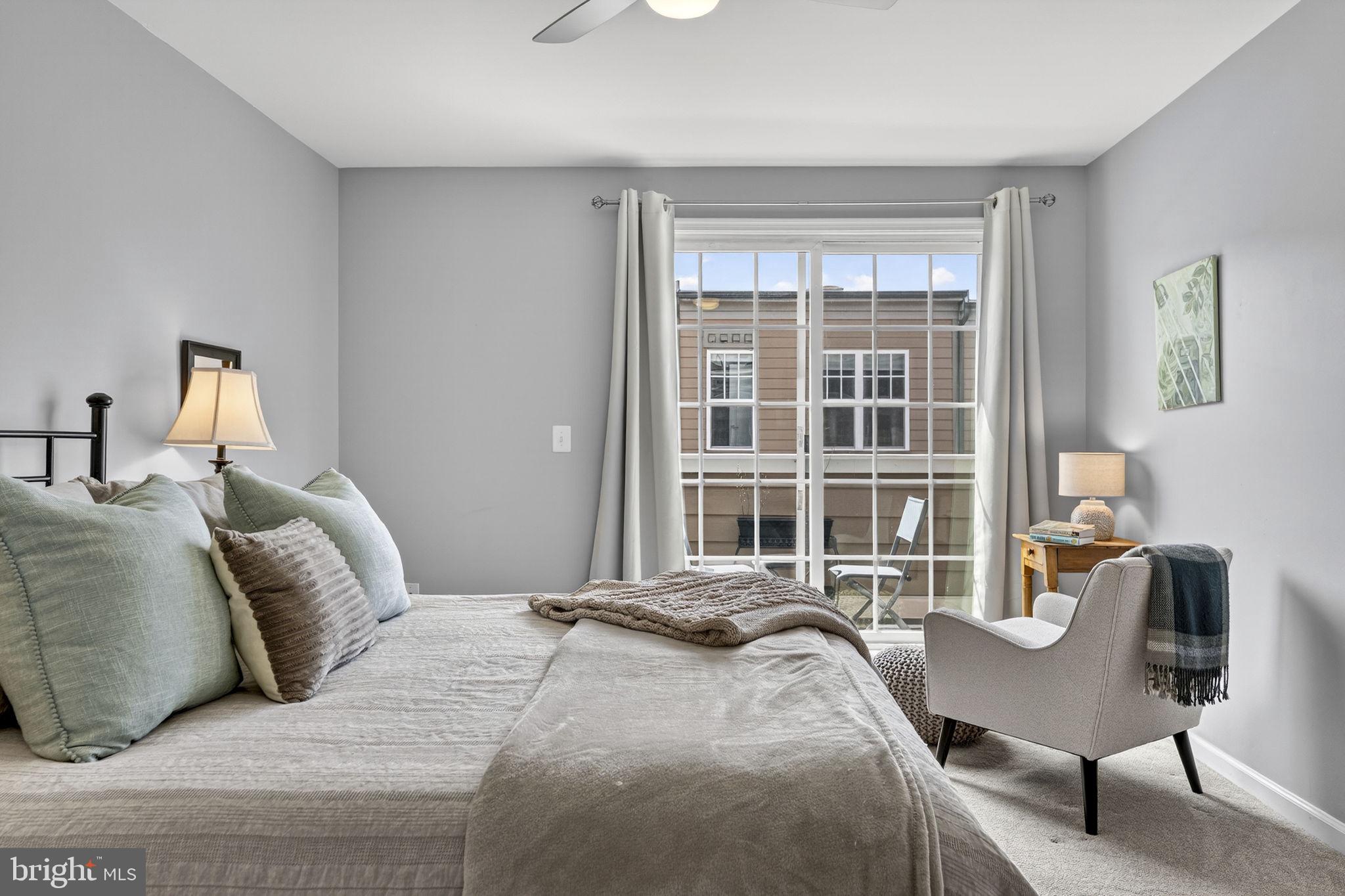 459 Haupt Square Southeast Leesburg, VA 20175 - Photo 50 of 80 a bedroom with a bed and a chair