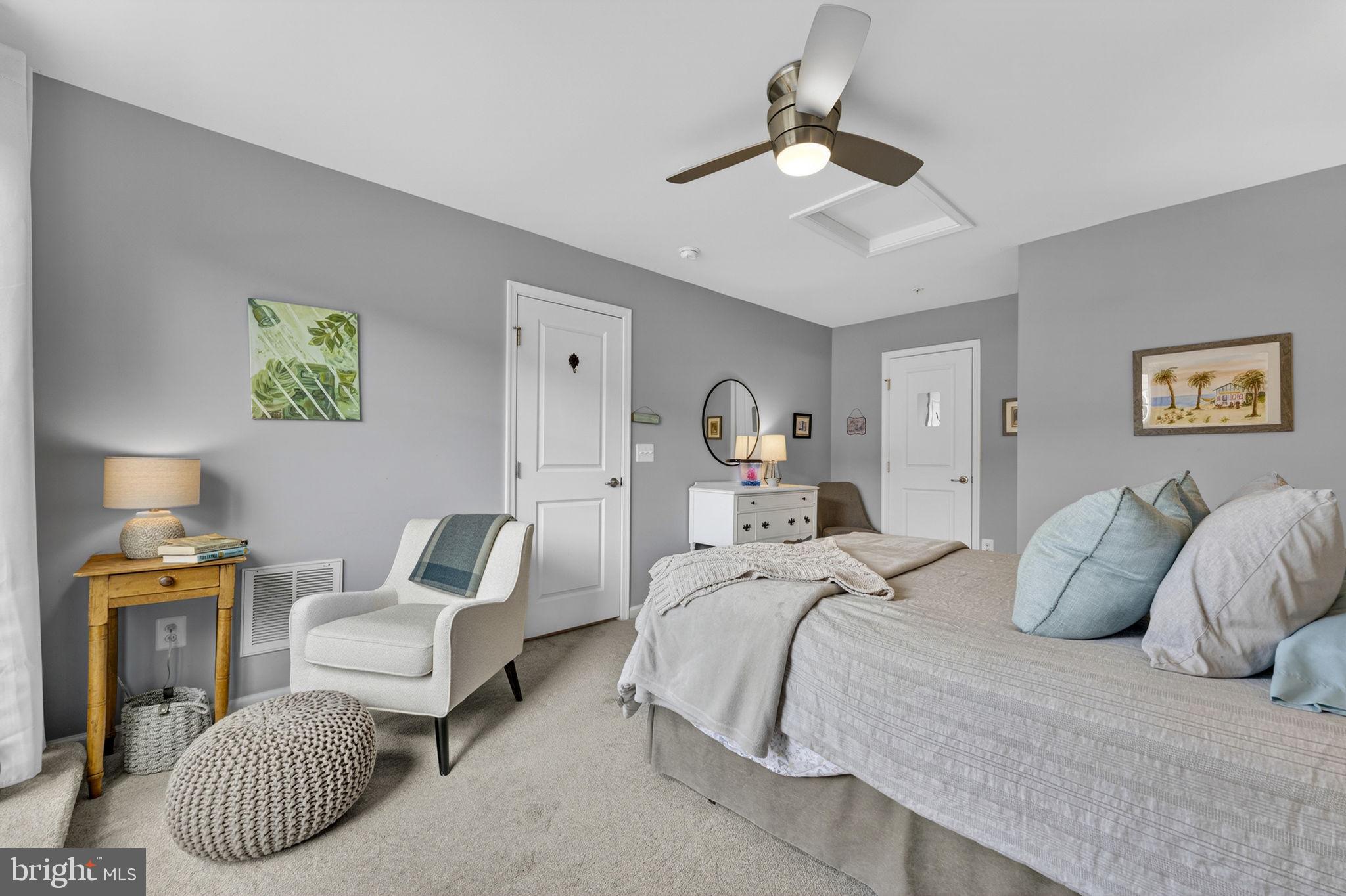 459 Haupt Square Southeast Leesburg, VA 20175 - Photo 52 of 80 a bedroom with a bed and a chandelier