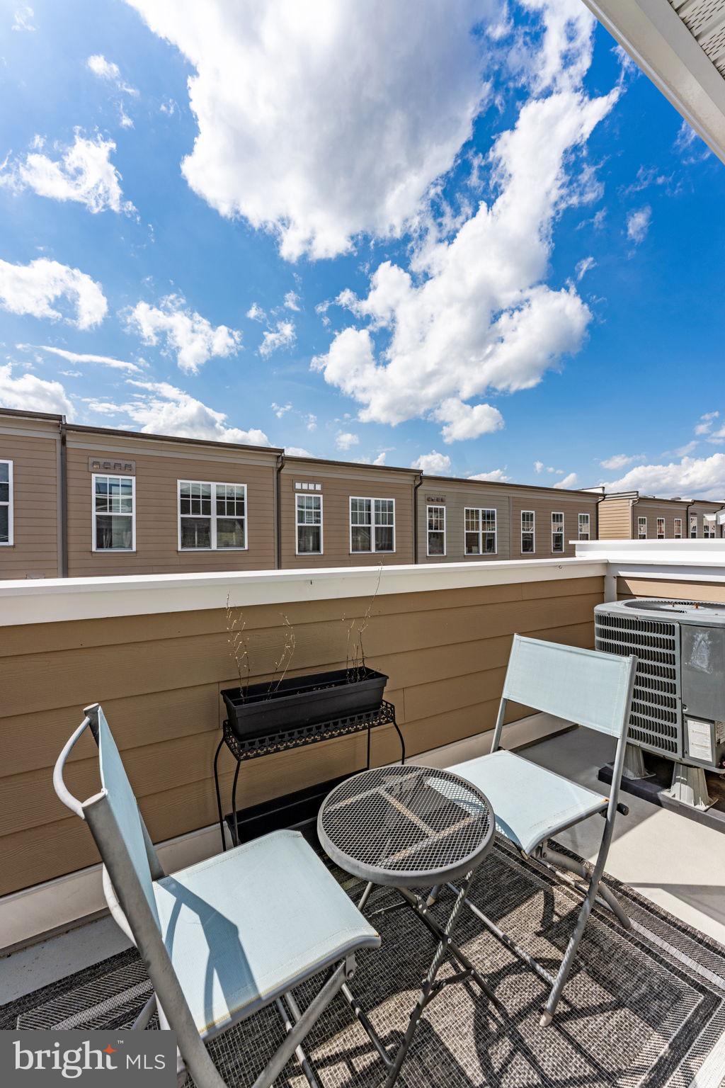 459 Haupt Square Southeast Leesburg, VA 20175 - Photo 57 of 80 a couple of table and chairs in the balcony