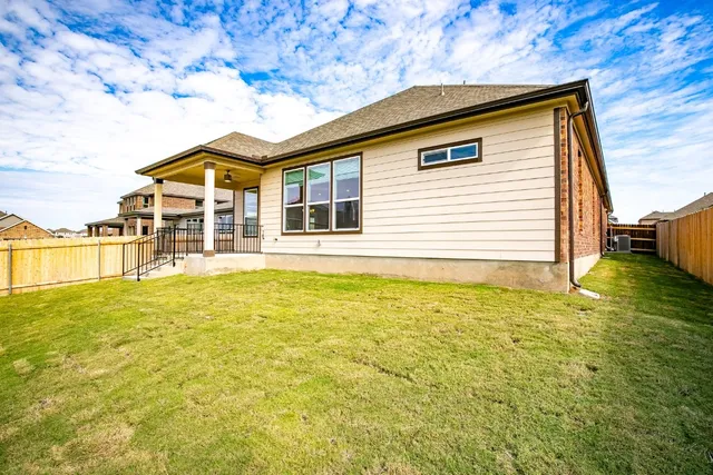 a view of a house with a backyard space