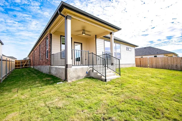 a view of backyard with a garden and deck