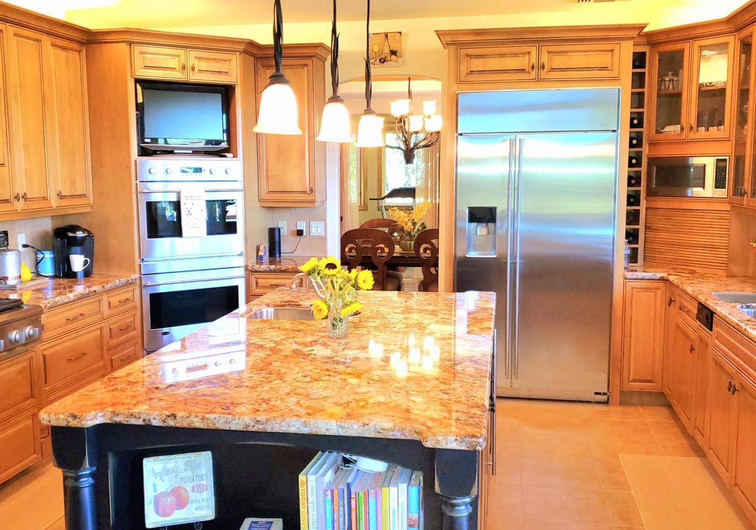 1440 Dog Bar Road Colfax, CA 95713 - Photo 17 of 93 Kitchen featuring stainless steel appliances, granite counter island with sink and entrance to the spacious dining room.