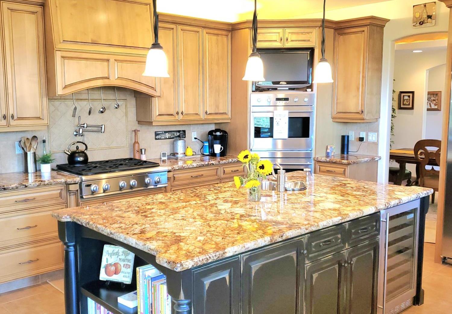 1440 Dog Bar Road Colfax, CA 95713 - Photo 18 of 93 Kitchen with light tile patterned floors, tasteful backsplash, light stone counters, open shelves, and recessed lighting