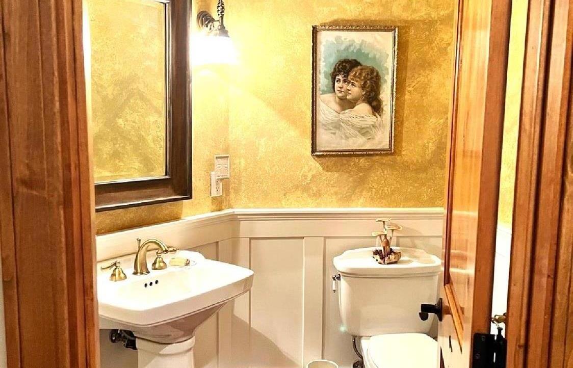 1440 Dog Bar Road Colfax, CA 95713 - Photo 25 of 93 Hallway Half Bath with pedestal sink, wainscotting and faux antique walls.