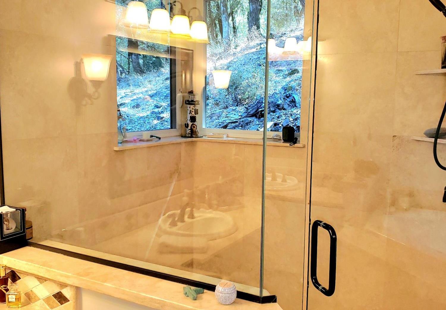 1440 Dog Bar Road Colfax, CA 95713 - Photo 31 of 93 Master bath featuring glass and tile shower stall with private forest views.