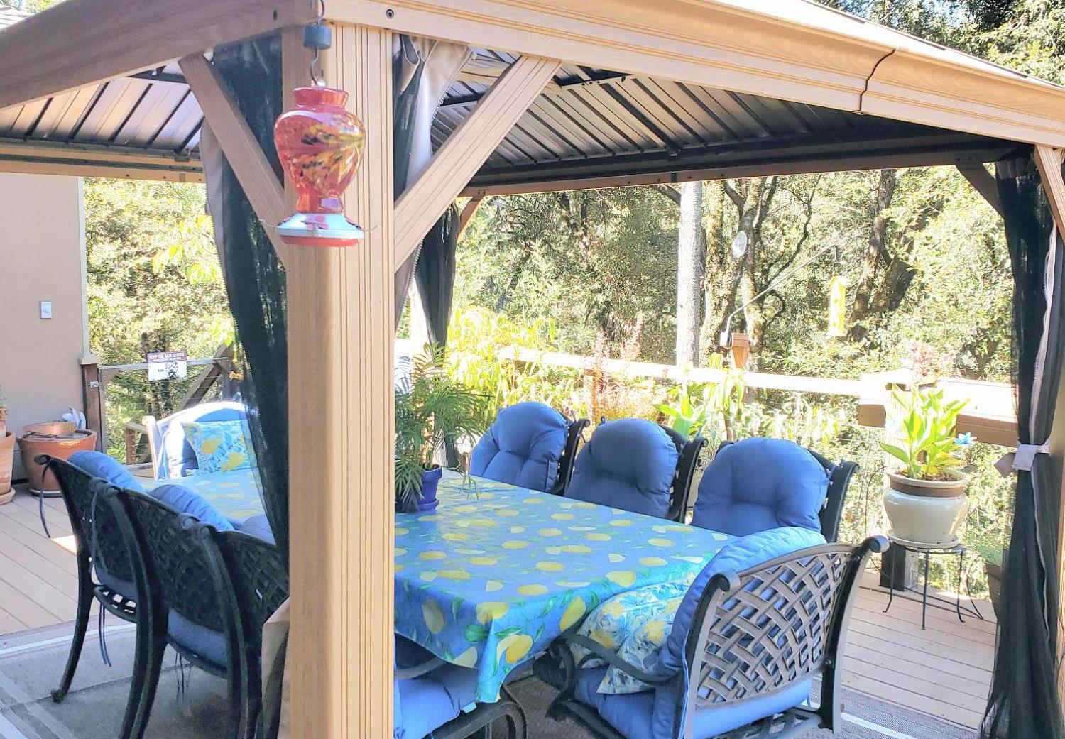1440 Dog Bar Road Colfax, CA 95713 - Photo 39 of 93 Trex deck featuring outdoor dining area and a gazebo.