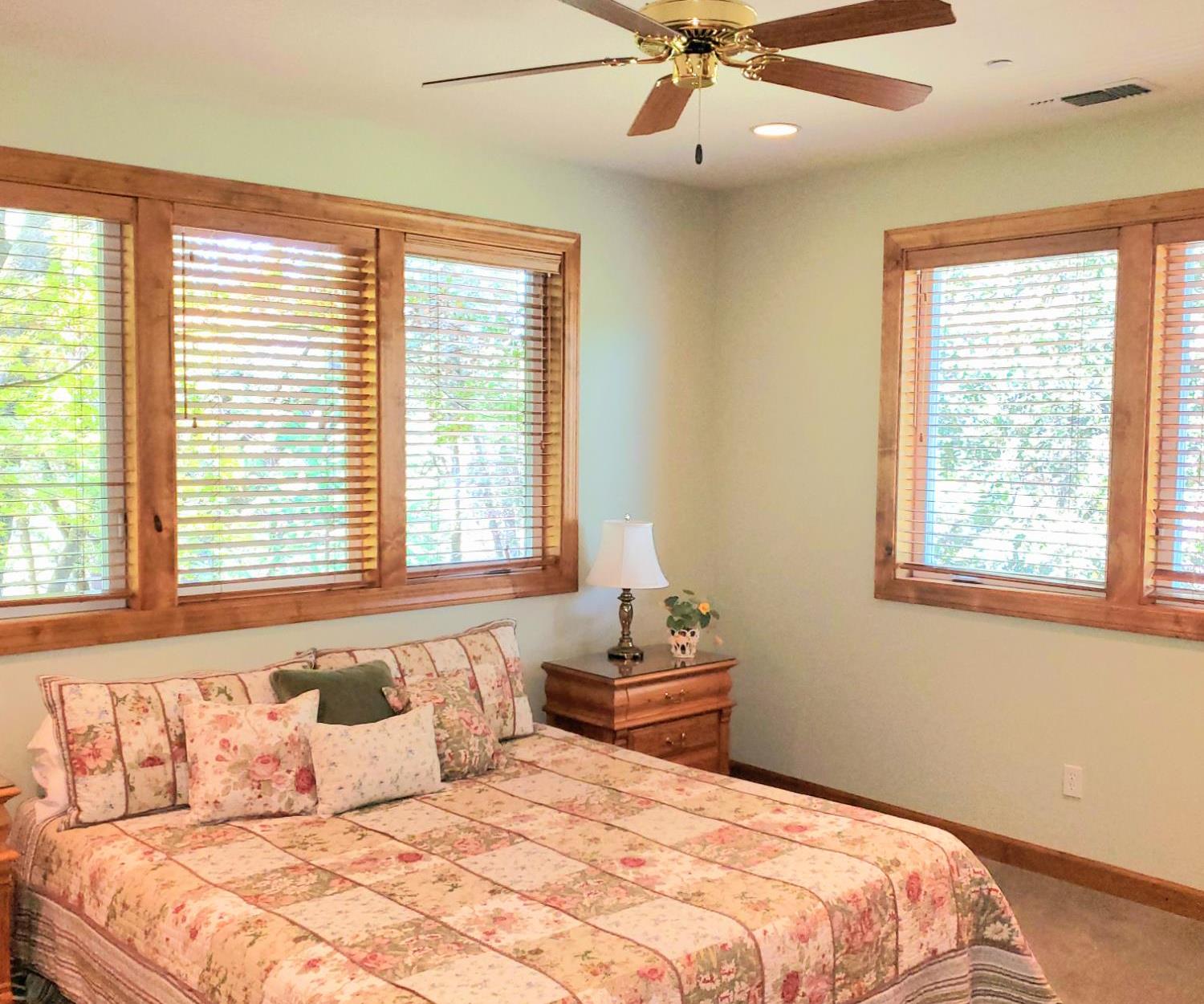 1440 Dog Bar Road Colfax, CA 95713 - Photo 54 of 93 Spacious bedroom 2 featuring multiple windows, ceiling fan, and recessed lighting. Sunlight fills this room!