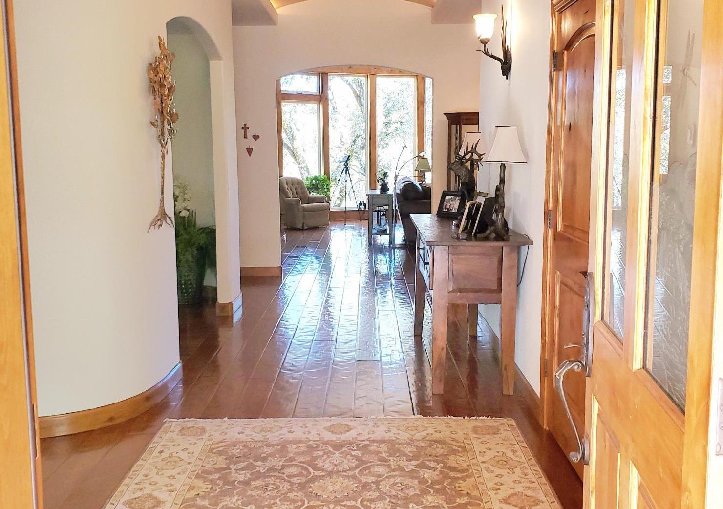 1440 Dog Bar Road Colfax, CA 95713 - Photo 9 of 93 Entrance hallway with engineered hardwood floors, arched walkways, rounded walls and vaulted ceiling