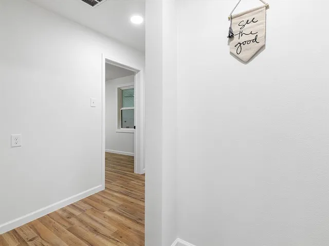 a living room with a table and a window