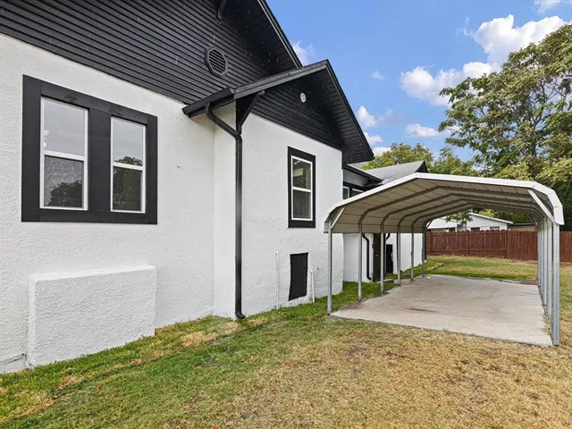 a house with trees in the background