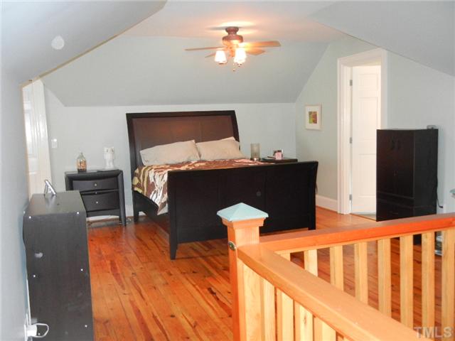 601 Harding Street Raleigh, NC 27604 - Photo 11 of 24 a bed room with furniture and a flat screen tv