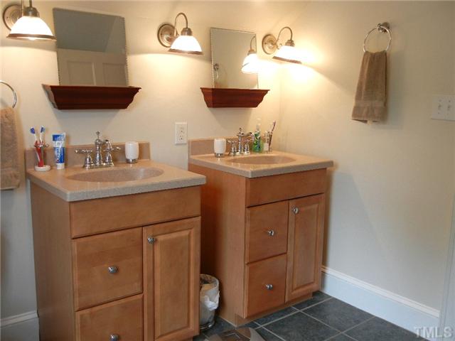 601 Harding Street Raleigh, NC 27604 - Photo 13 of 24 a bathroom with a sink and a mirror