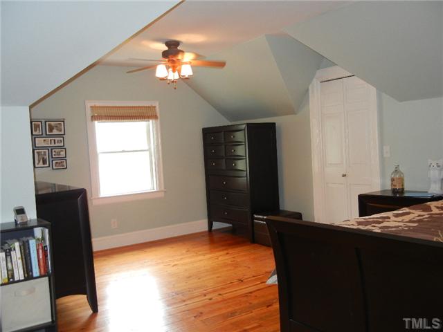 601 Harding Street Raleigh, NC 27604 - Photo 9 of 24 a bedroom with a bed and a television