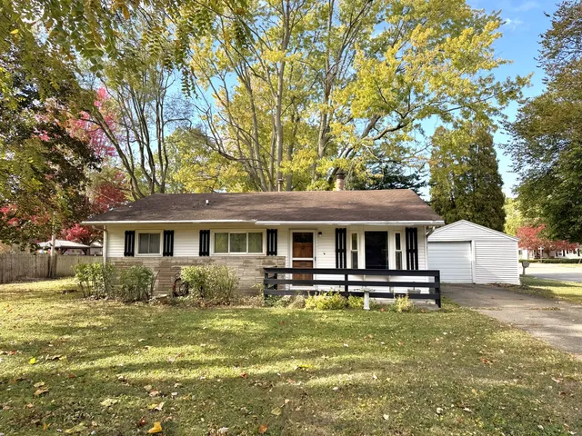 a front view of house with yard space and swimming pool