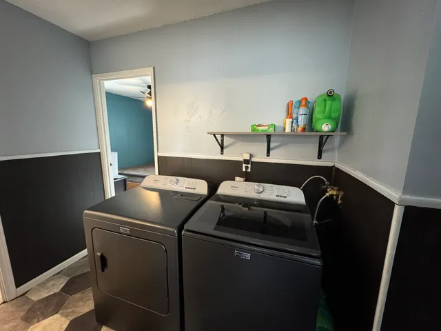 a utility room with dryer and washer
