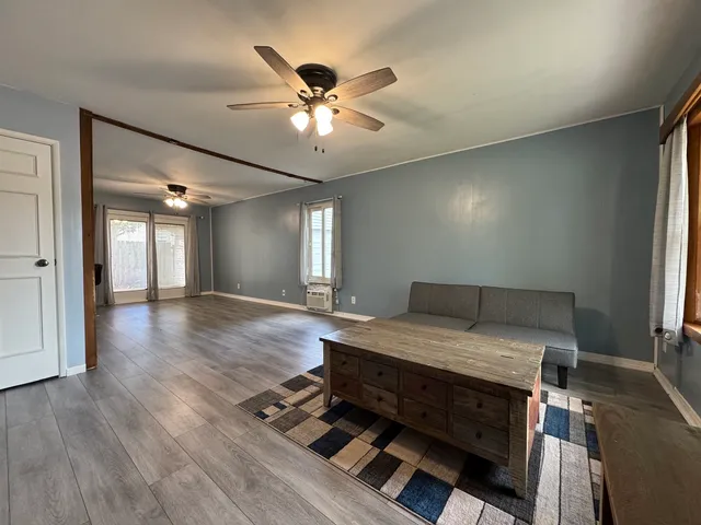 a room with a bed and a chandelier