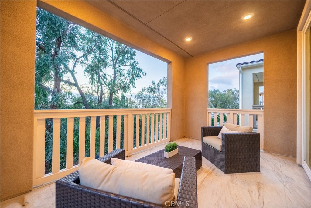 599 Serrano Summit Drive Lake Forest, CA 92630 - Photo 11 of 19 a balcony with furniture and large window