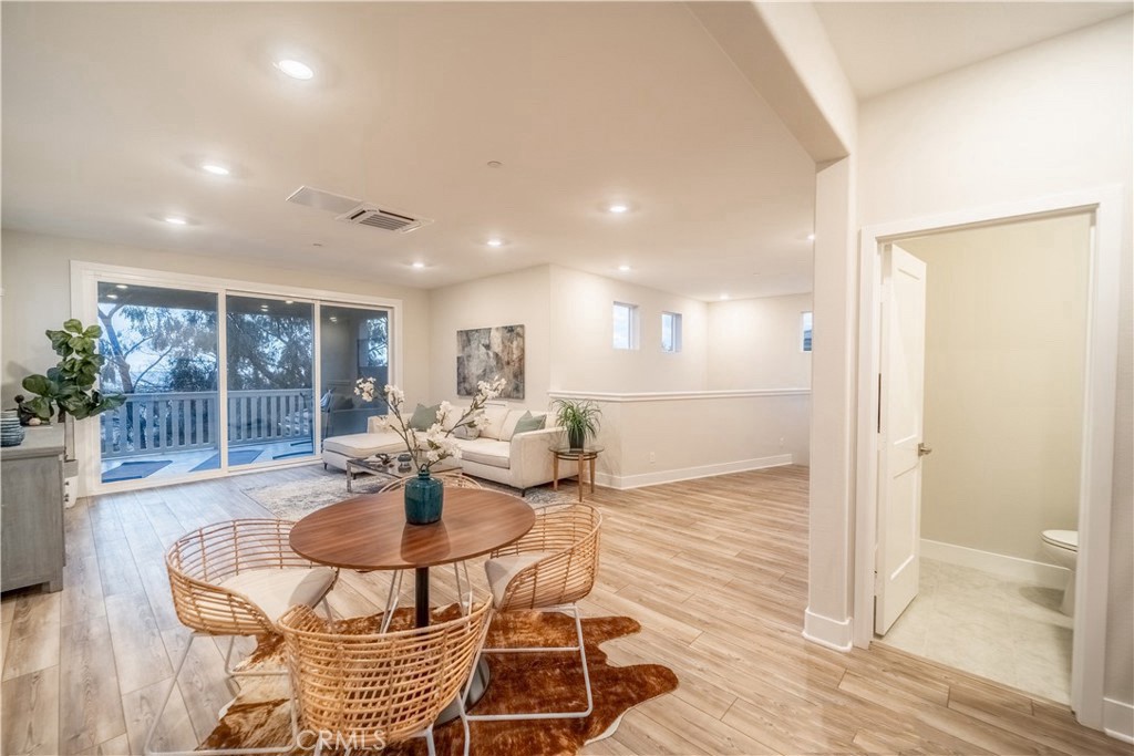 599 Serrano Summit Drive Lake Forest, CA 92630 - Photo 12 of 19 a dining room with furniture and a floor to ceiling window