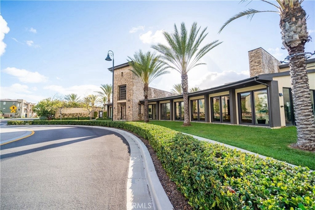 599 Serrano Summit Drive Lake Forest, CA 92630 - Photo 16 of 19 a view of a house with a yard and potted plants