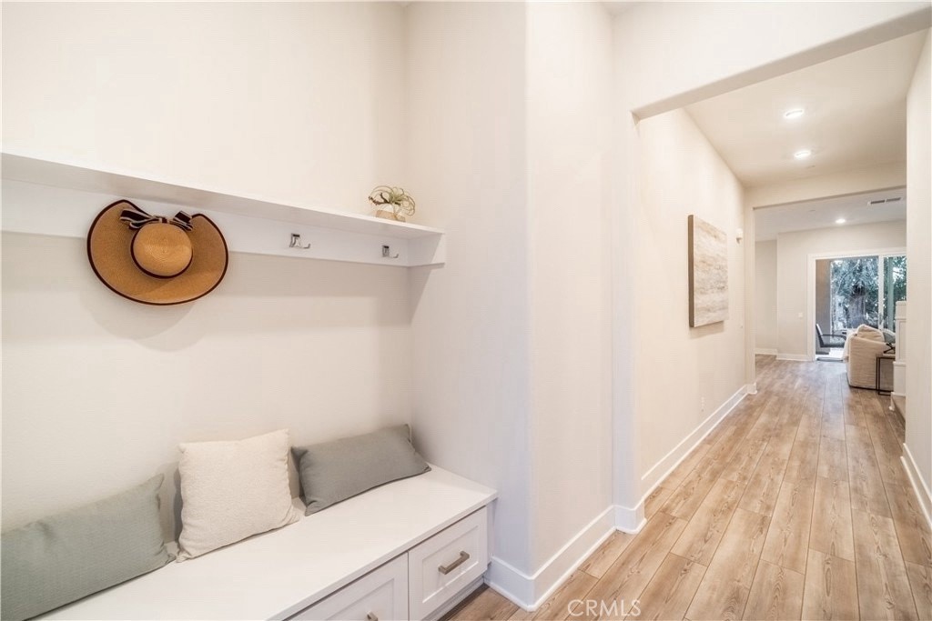 599 Serrano Summit Drive Lake Forest, CA 92630 - Photo 2 of 19 a bathroom with a toilet and a wooden floor