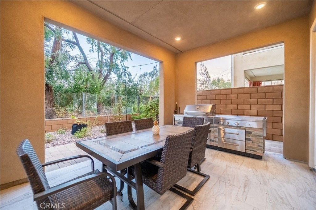 599 Serrano Summit Drive Lake Forest, CA 92630 - Photo 8 of 19 a view of a dining room with furniture and wooden floor
