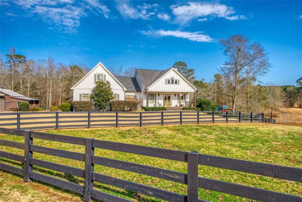 1240 Shepherd Road Madison, GA 30650 - Photo 1 of 1 a view of a house with backyard and trees