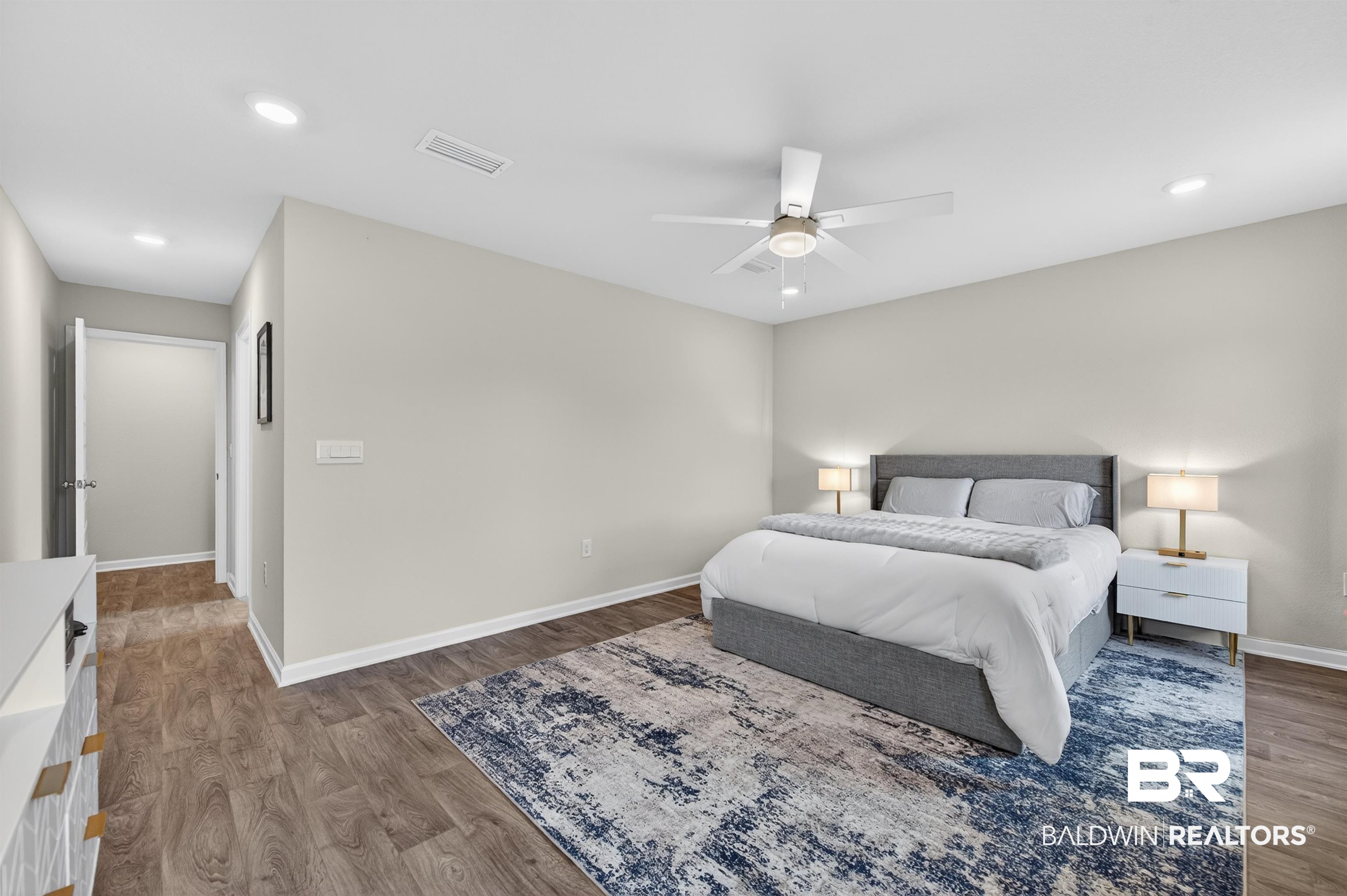 3213 Camino Real Loop Lillian, AL 36549 - Photo 36 of 61 Spacious bedroom featuring wood-finish flooring, recessed lighting, and a ceiling fan
