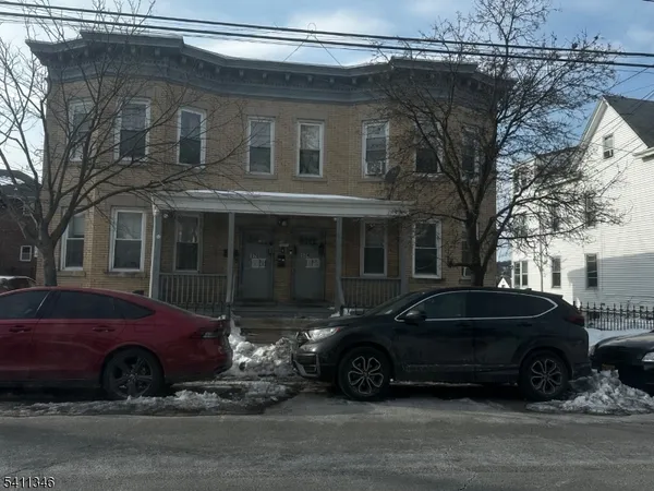 a car parked in front of a house