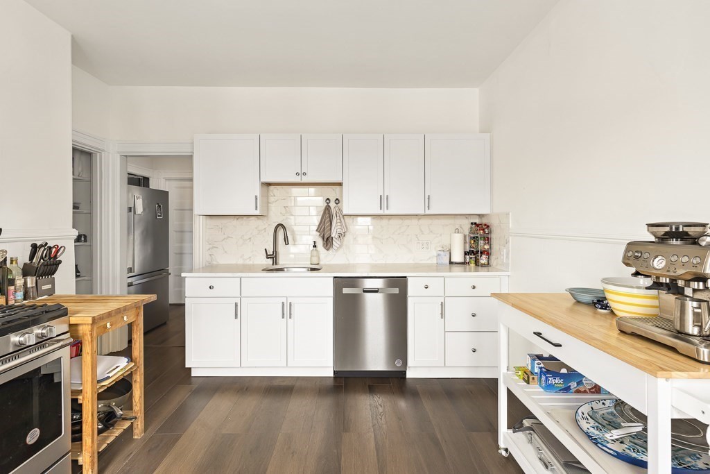 55 Main Street Somerville, MA 02145 - Photo 1 of 28 a kitchen with appliances a sink and cabinets