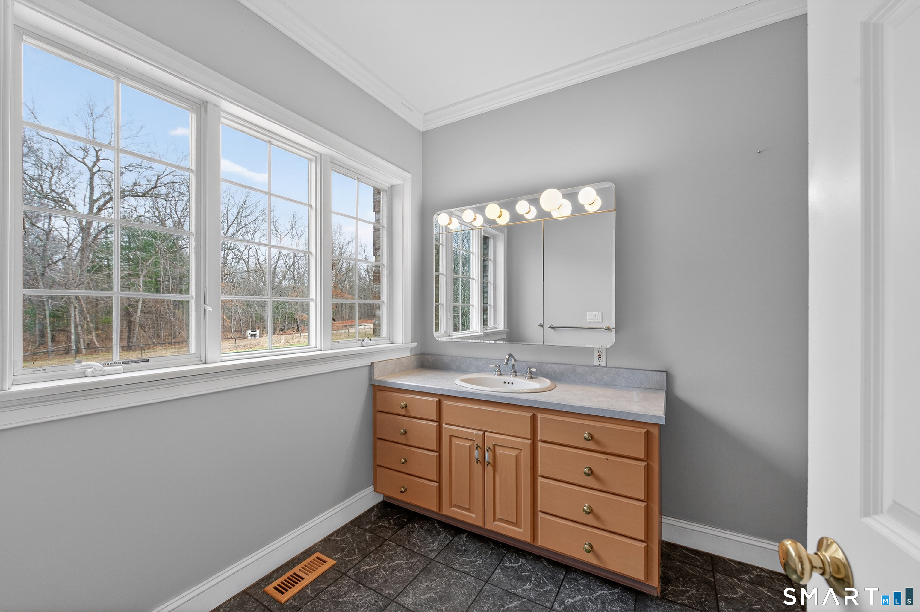724 Strong Road South Windsor, CT 06074 - Photo 13 of 39 a bathroom with a double vanity sink and mirror with window
