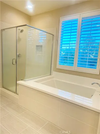 a bathroom with a bathtub and a shower