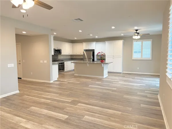 a view of kitchen and wooden floor