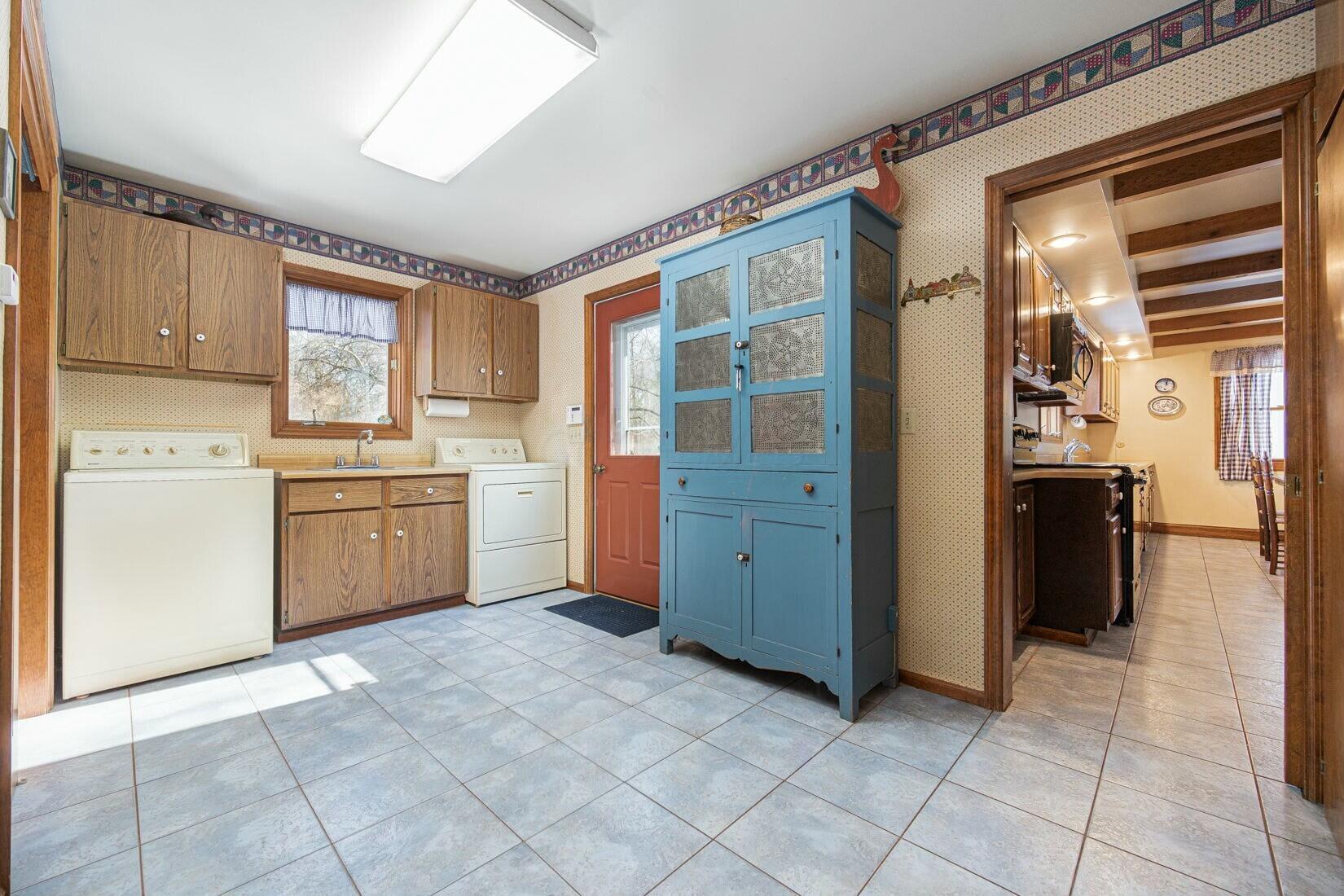 4446 Dublin Road Columbus, OH 43221 - Photo 25 of 62 Laundry room/Mud room easy access from garage and kitchen with access to side yard.